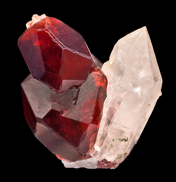 fuckyeahmineralogy:  Spessartine Garnet on Quartz; Haramosh Mts., Gilgit-Baltistan,