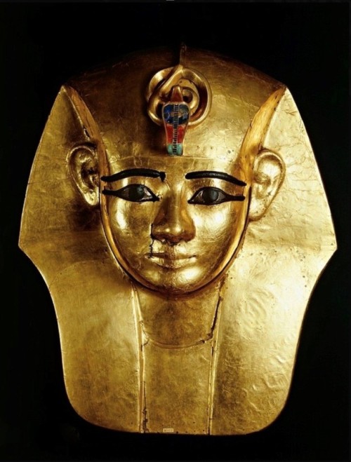 Mask of King AmenemopeThis mask was part of the mummy-shaped coffin of gilded wood of Amenemope. The