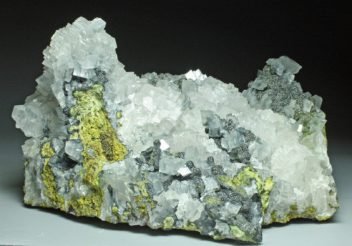 hematitehearts:  Mottramite on Calcite RhombsLocality:  Tsumeb Mine, Tsumeb, Namibia  Size:   12.1 x 9.7 x 6.9 cm  