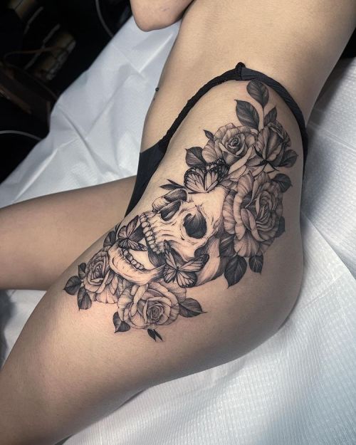Two Purple Roses With Compass And Butterfly Tattoo On Right Thigh