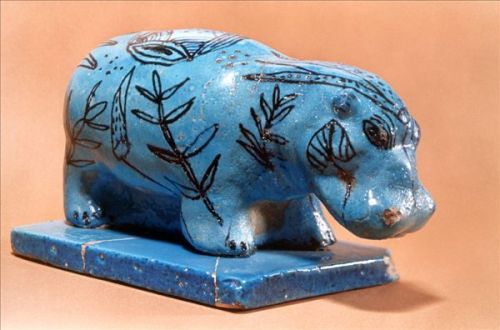 Statuette of a HippoThis benevolent-looking hippopotamus slips into the marshes, taking on their col