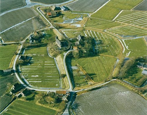 An artificial dwelling hill is a mound, created to provide safe ground during high tide and river fl