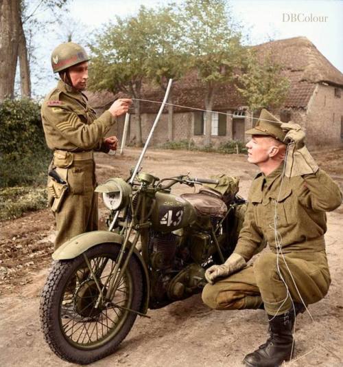 Corps of Military Police motorcyclists demonstrate how a metal rod fitted to a motorcycle can preven