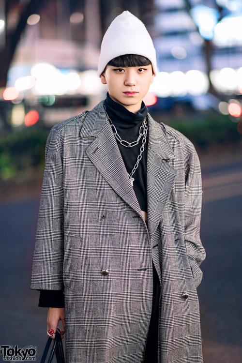 17-year-old Japanese student Billimayu on the street in Harajuku wearing a long vintage coat over a 