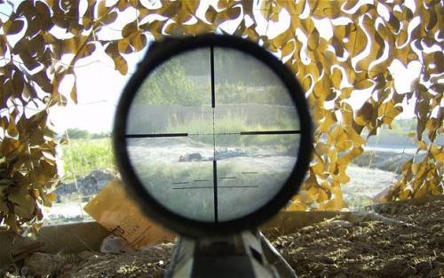 View through the scope of a sniper showing the bodies of two dead Taliban fighters. (via FUNKER530)