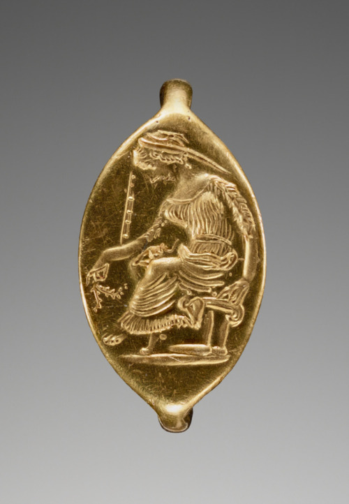 theancientwayoflife:~ Engraved Ring with a Seated Woman Holding a Branch.Culture: GreekDate: late 5t