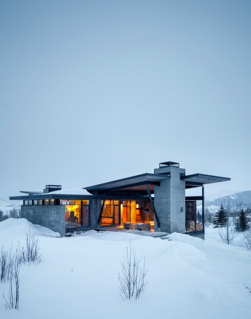 stylish-homes:  Outdoor room with fireplace and a beautiful view of the mountain range in Jackson Hole, Wyoming. Sliding barn doors can be used to enclose the space. 