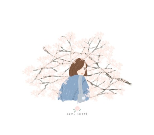 A girl surrounded by cherry blossoms