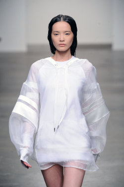 nanakorobii:  wgsn: A brilliant execution of the minimalist sport trend at skingraft yesterday. We’re loving the voluminous sheer sleeves with luxe stripes on this oversized hoodie #nyfw #ss14 