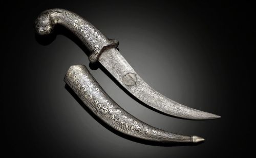 art-of-swords:  Jambiya Dagger Dated: 19th century Culture: Moroccan Measurements: Overall length: 14”; blade length: 8 1/4” This particular dagger features a beautifully detailed silvered hilt and scabbard, which protects the fine Damascus steel