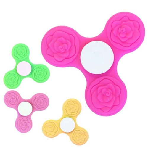 sodastim: [Image description: four tri-spinner shape fidget spinners, each with rose-shaped raised p