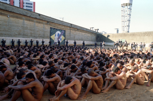 evileamon: Prisoners made to strip naked and huddle together. In the last pic two men are made to sq