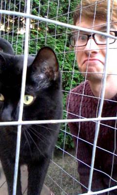 sombre-songbird:Me and my cat ,Oscar, who hates me (but loves me at night when theres no one else to give him attention)