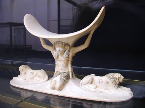 One of eight headrests found inTutankhamun&rsquo;s tomb.  Made of ivory, it has the god Shu supporti