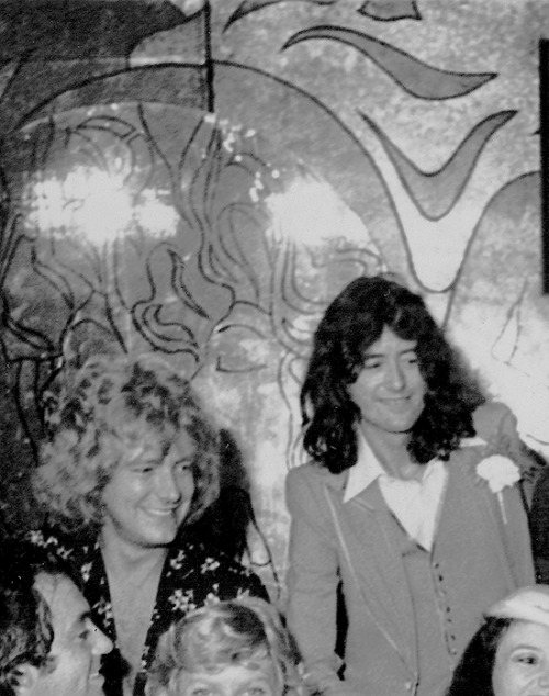Robert Plant and Jimmy Page poses for a group portrait of the wedding parties and guests from two ma
