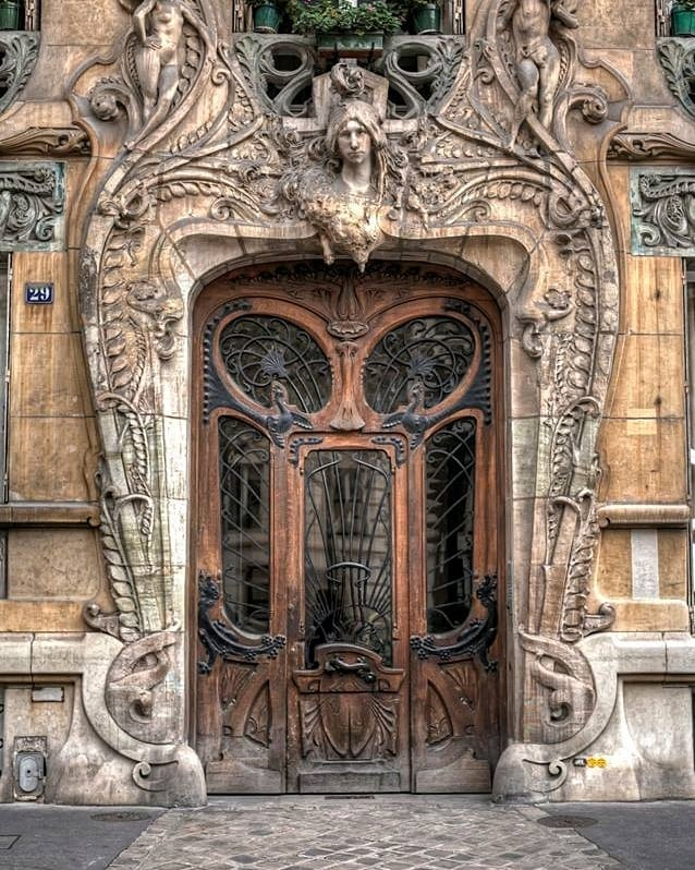 steampunktendencies:The best door in Paris, France⠀At 29 Avenue Rapp in the 7th