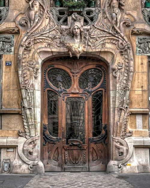 steampunktendencies:The best door in Paris, France⠀At 29 Avenue Rapp in the 7th arrondissement, very