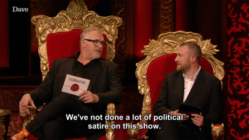 [ID: Two screencaps from Taskmaster. Greg Davies says, “We’ve not done a lot of political satire on 