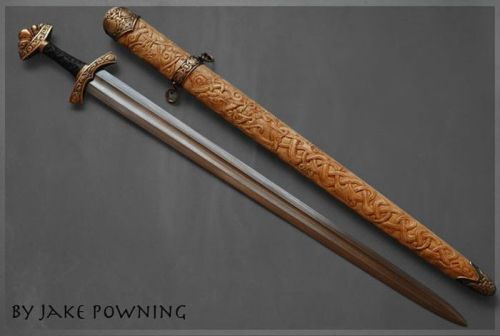 art-of-swords:  Handmade Swords - Wardhllokur (Spirit Song) Maker & Copyright: Jake Powning Measurements: overall length 86.4 cm; weight: 1,275 kg A pattern-welded Viking sword made in 2009. It feature a bog-oak grip while the scabbard if yellow