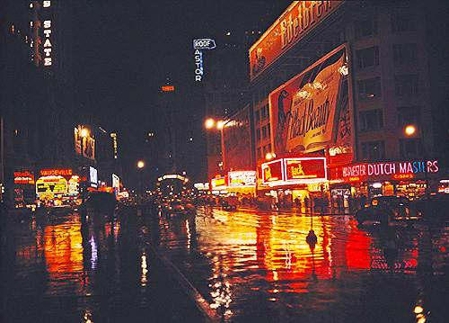 :  Rainy night in Times Square, New York. Photographed by Walter Berk. (1947) 