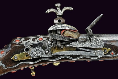 Beautiful miquelet musket of Algerian origin, 19th century.  Decorated with silver mountings and stu