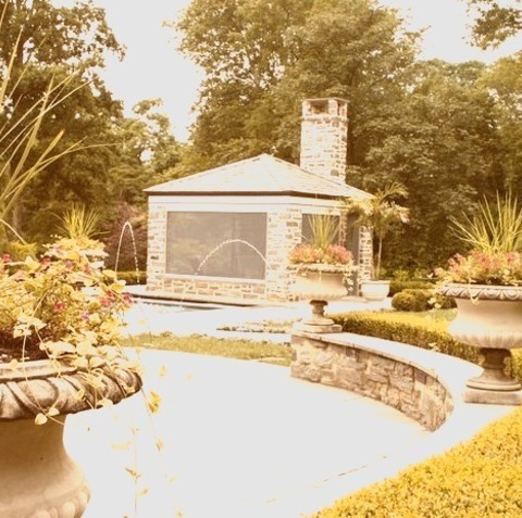 Inspiration For A Large Traditional Full Sun Backyard Stone Formal Garden.