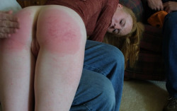 freespank:  Redhead girl over the knees