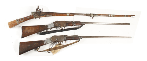 A Turkish miquelet lock musket  (top) and two Arab Martini-Henry rifles (bottom).
