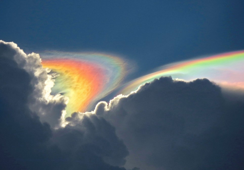 nubbsgalore:  iridescent pileus cloud photos by esther havens in ethiopia, becky bone dunning in jamaica, ken rotberg in florida, and david lapuma. as a cumulus cloud containing warm air convects upwards and condenses, a thin layer of humid air containing