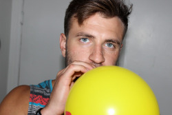 My Friend Chris Blowing A Balloon. 