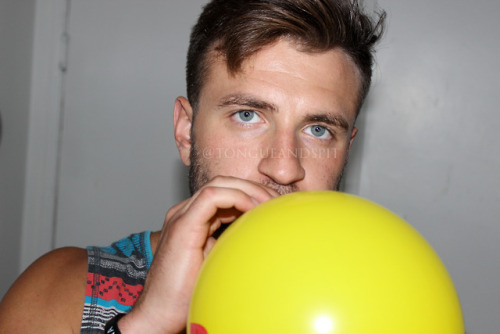 My friend Chris blowing a balloon.  adult photos
