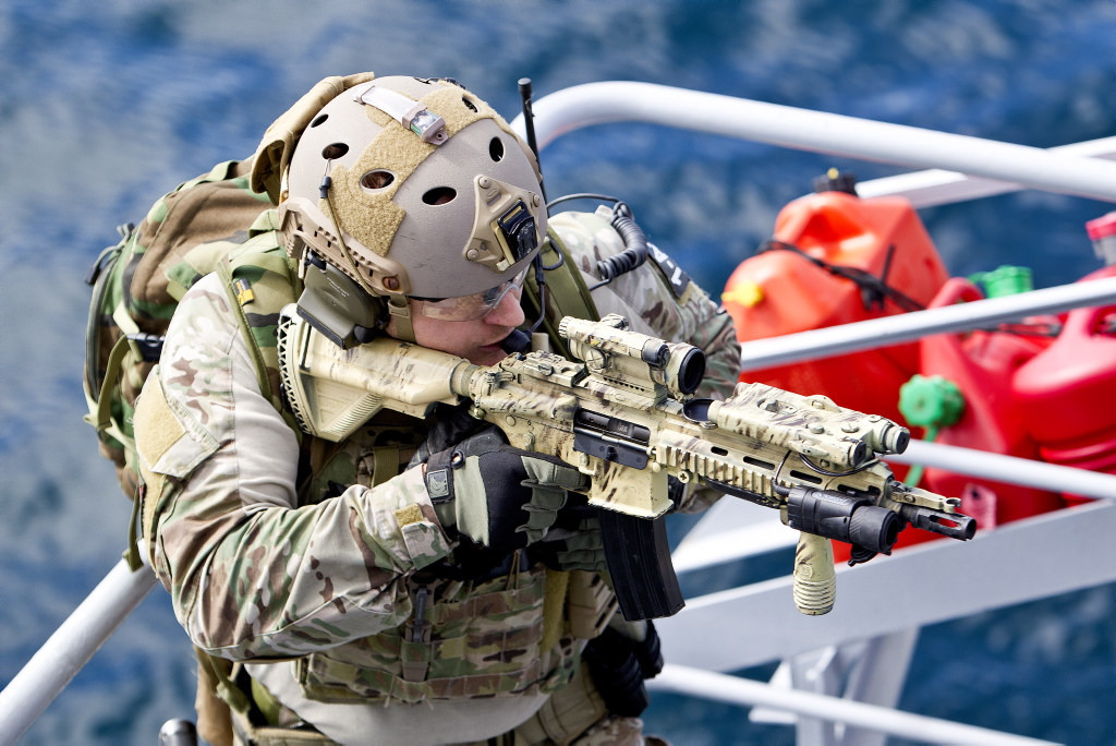 A member with the Norwegian Naval Special Operations Command/MJK practicing on a visit, board, search and seizure (VBSS) on the Norwegian cruiser Roald Amundsen before leaving on a mission for the Gulf of Aden.