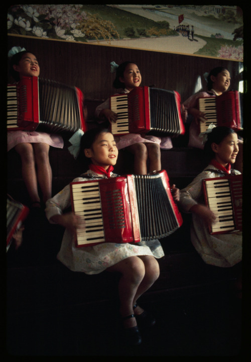 North Korean school girls practice playing accordions, August 1974.Photograph by H. Edward Kim, Nati