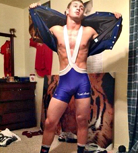 look at this dude showing off his bod in the singlet in his room…..fuckin show off…..love that cocky attitude…..he better bring that 2 the ring!!