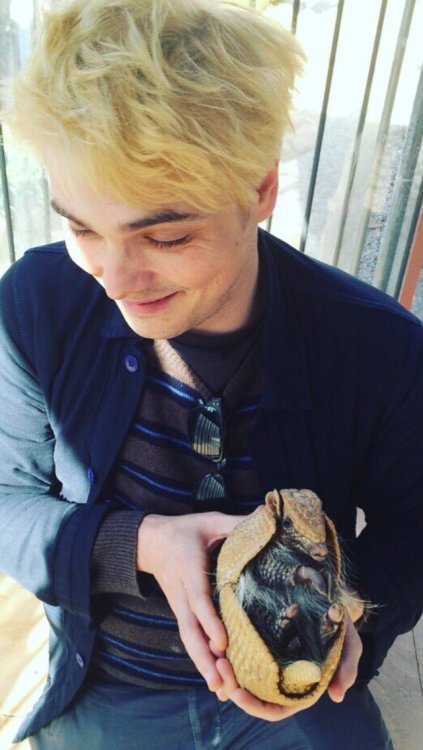 vacationadventuresociety: Gerard holding an armadillo (source)