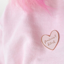 ambivalentlyyours:  When life gives you sexist lemons, you paint that shit pink and rose gold. I’m so excited to introduce my favourite creation yet: the Feminist Bitch soft enamel pink and rose gold lapel pin.  Available here. 