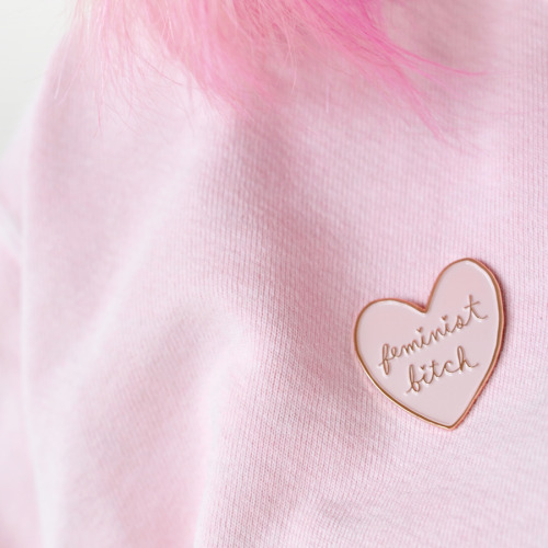 ambivalentlyyours:  When life gives you sexist lemons, you paint that shit pink and rose gold. I’m so excited to introduce my favourite creation yet: the Feminist Bitch soft enamel pink and rose gold lapel pin.  Available here. 