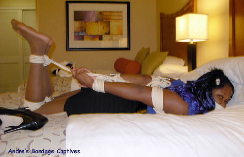 andretoonman:  Sexy Kitty Deane is tape gagged and hogtied in her pretty stockinged feet!  This set 