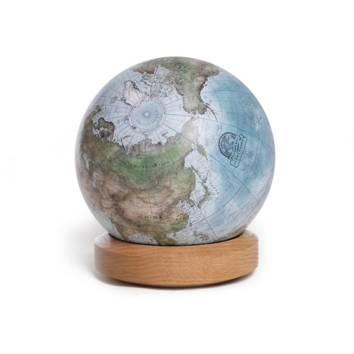 Earth from space! This style of globe is reminiscent of the famous Pale Blue Dot photograph. Painted