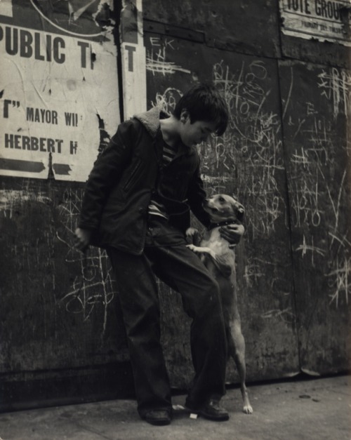 oldnewyorklandia:Sandra Weiner.  Boy and his dog on the sidewalk, New York City, ca. 1945. 