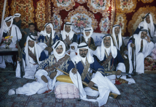 Armed Bedouin Beni Sakhr chiefs await their king&rsquo;s visit in Jordan, December 1964.Photogra