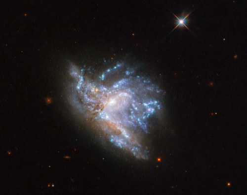 space-pics:Hubble’s Dazzling Display of Two Colliding Galaxies by NASA Goddard Photo and Video