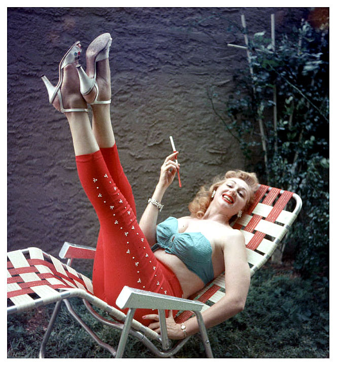 Lynne O’Neill enjoys a relaxing smoke break in her backyard..