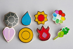 feelmeglowing:  saveroomminibar:  Sanshee’s Pokemon League Badge Replica’s.  I need these.   42 badges or bust.