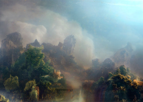 paimona: “Kim Keever shoots large-scale photographs of incredibly detailed landscapes in a 200-gallon tank of water. The tank is filled with water or dry ice and lit with gel-covered lights to transform the strange world into a hazy, fantastical world.”