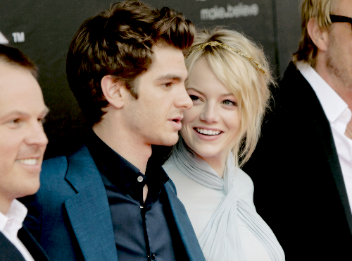 stonefieldofdreams:  9 photos of Emma Stone looking completely in love with Andrew