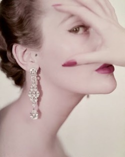 fawnvelveteen:  Clifford Coffin, Mary Jane Russell wears long rhinestone earrings, with her right hand over her face, 1950.