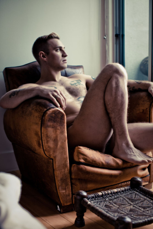 ADAM KLESH nude in leather chair -photographed by landis smithers