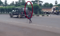 sixpenceee:  In this peculiar video, a strange shadow seems to be following an old man as he crosses the street. One possibility is that this is a camera artifact of some kind, but the same anomaly does not appear on other people crossing the street.