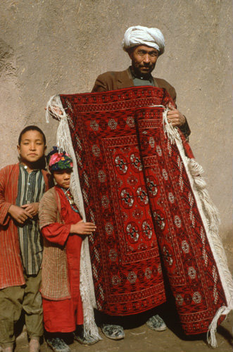 Turkmen with carpets in Herat, Afghanistan.